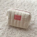 Space NK Cream Quilted Cosmetic Bag