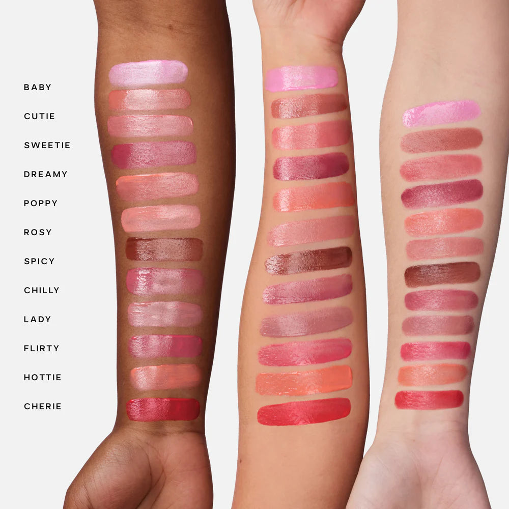 Saie Dew Blush shade swatches across three skin tones